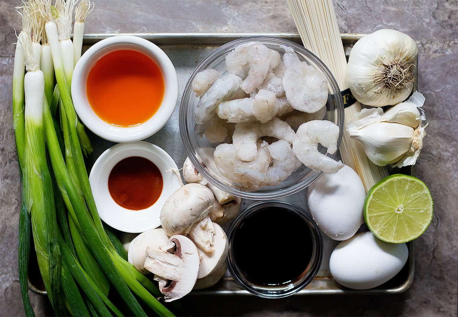 Spicy Ramen ingredients are chicken stock, shrimp, garlic, noodle, lime, soft boiled eggs, sesame oil, mushrooms and sriracha.