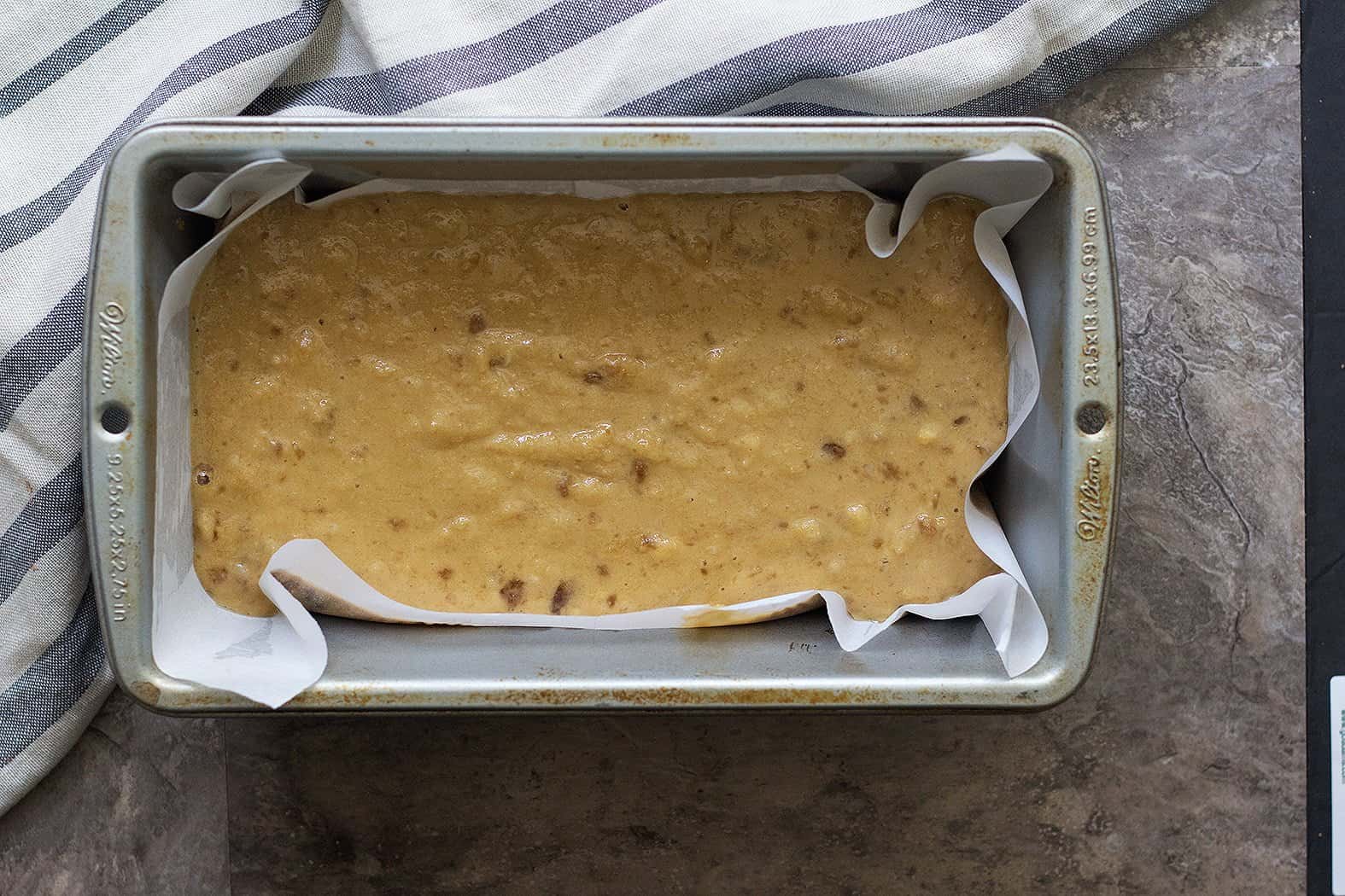 Pour the almond flour banana bread batter into the 9x5 loaf pan and bake in the oven. 