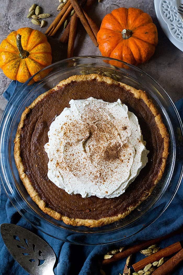 Learn how to make the best ever homemade pumpkin pie flavored with aromatic chai spices. This easy pumpkin pie is perfect for the Holidays.