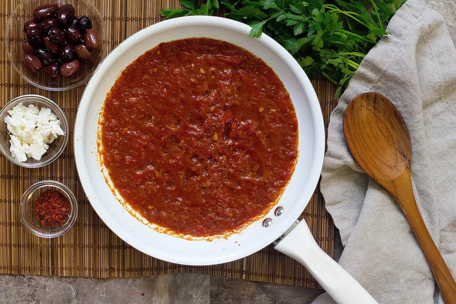 Start by simmering the shakshuka sauce.