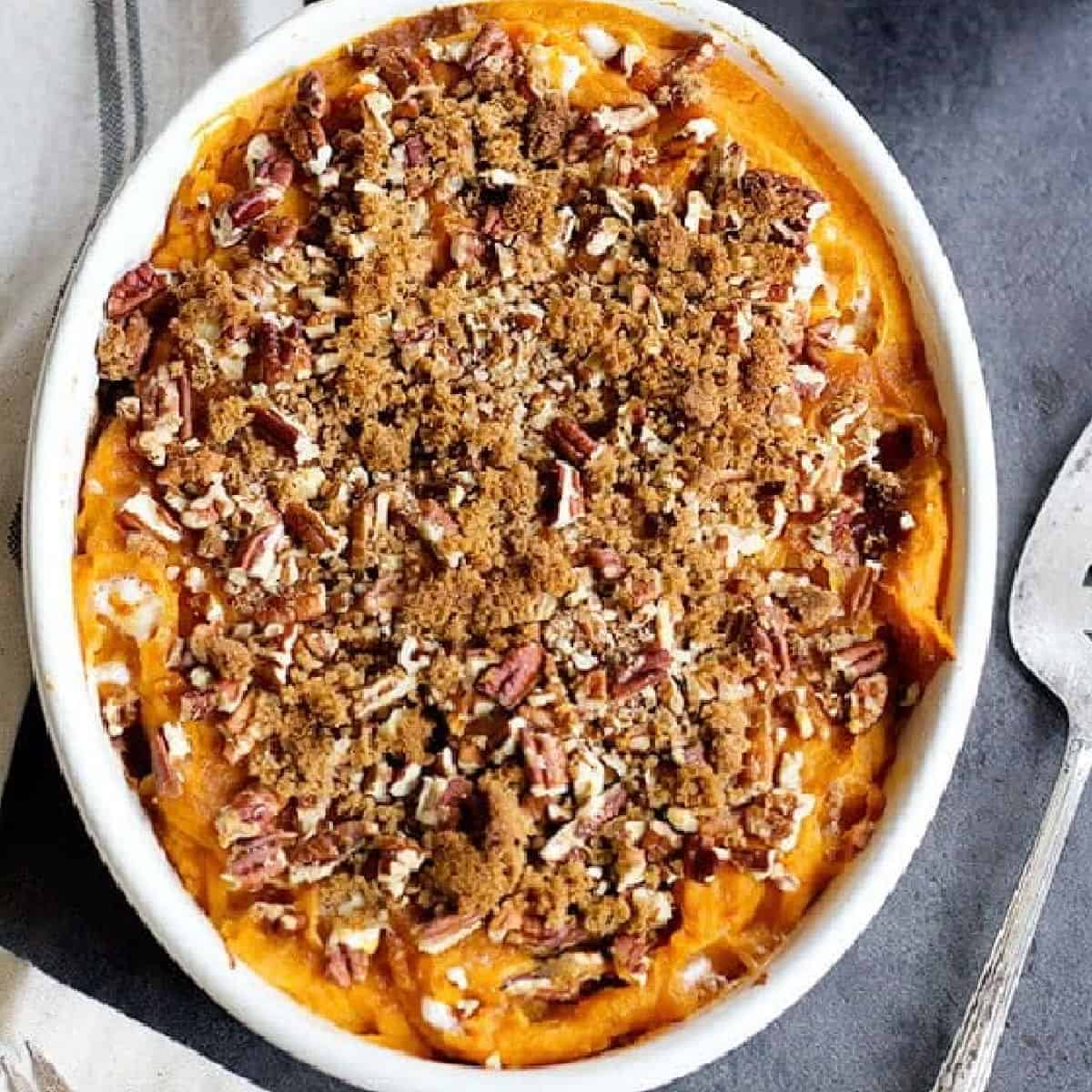 This classic Sweet Potato Casserole is a must-have for Thanksgiving. It's easy, fluffy and perfectly sweet. And, pecans add just the right amount of crunch! 
