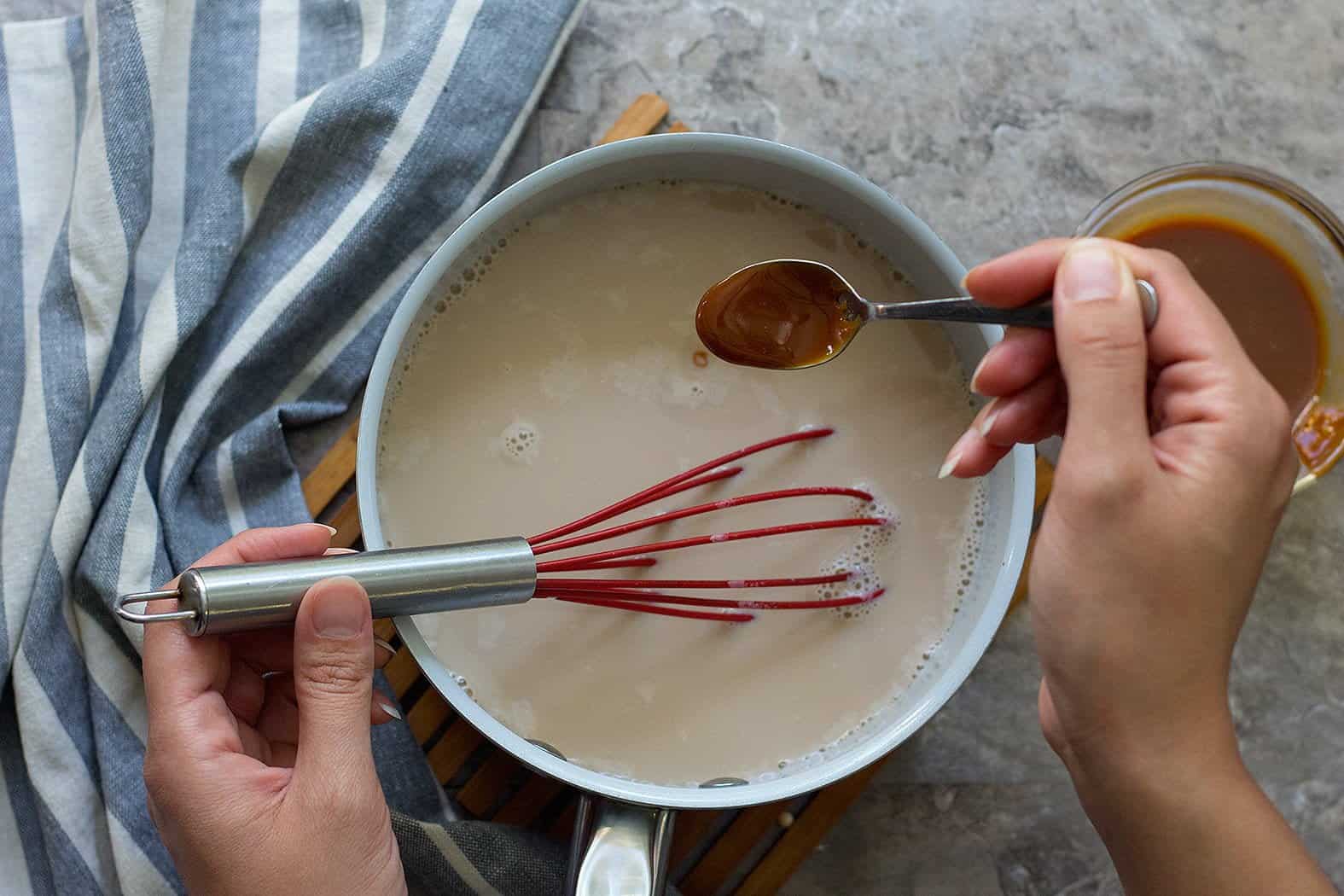 Heat cold milk, caramel sauce and sugar over medium heat until bubbles start appearing on the edges and caramel sauce and sugar have dissolved completely. 