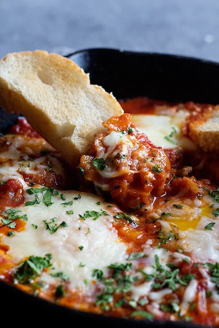 Dip the bread into cheesy delicious baked eggs. 