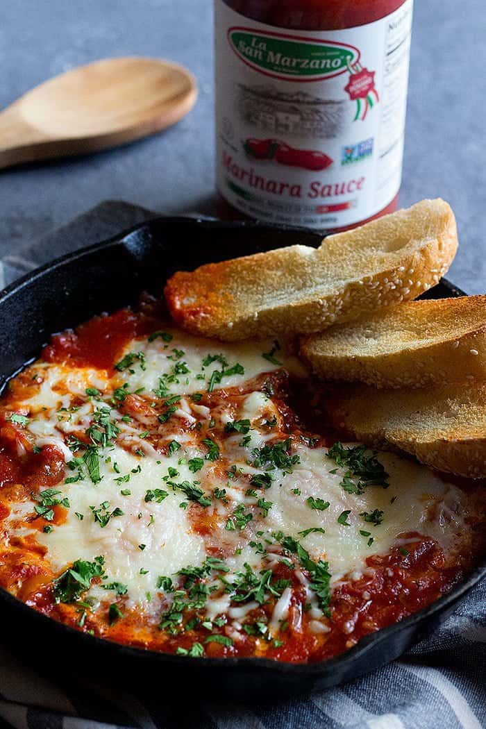 Top breakfast egg bake with chopped parsley. 