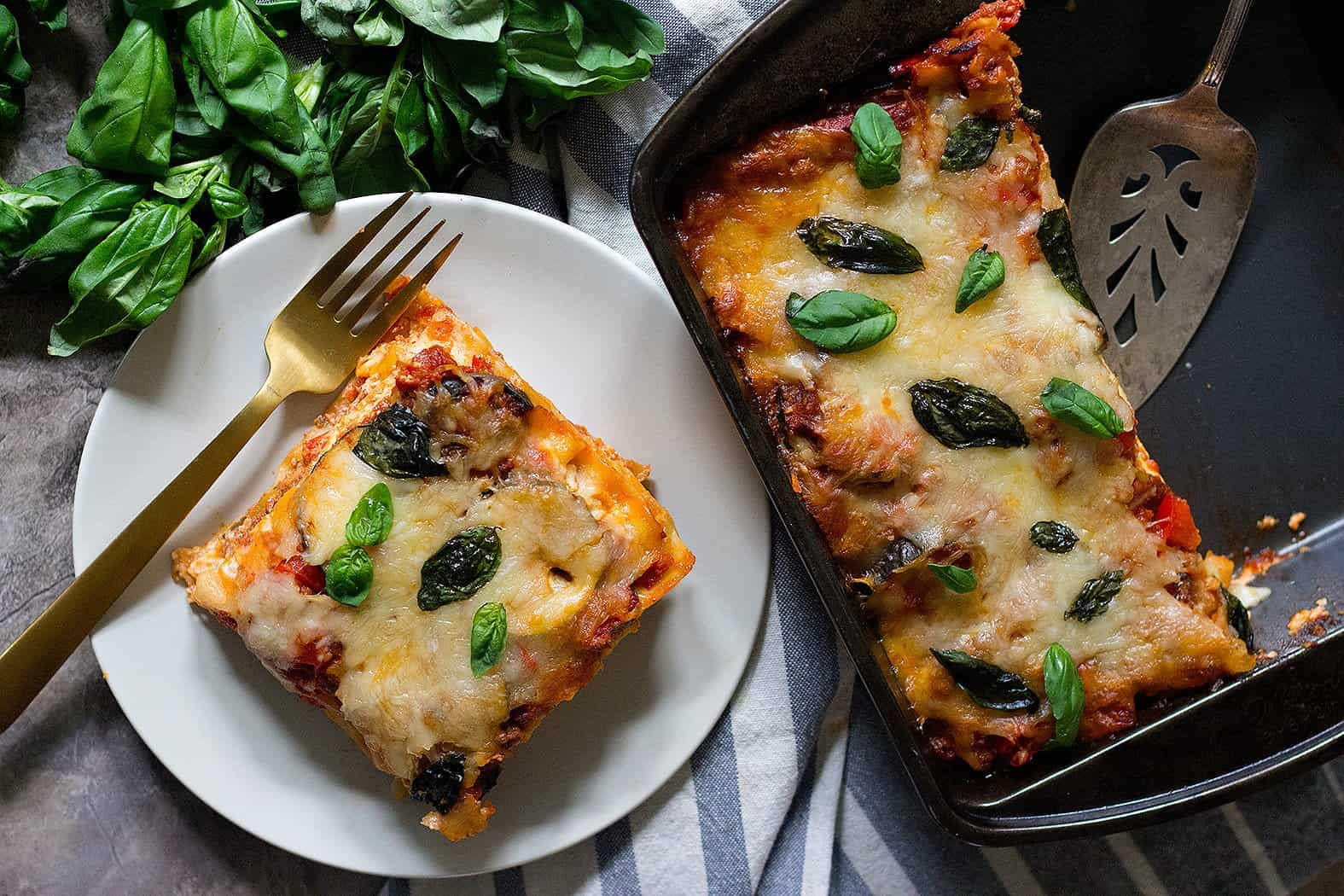 Bake vegetable lasagna in the oven until the noodles are fully cooked. 