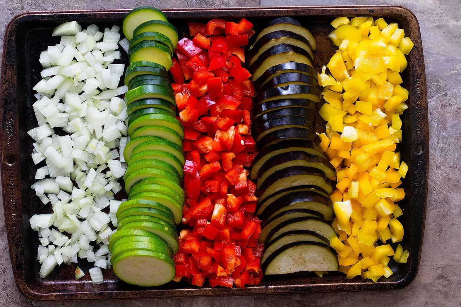 To make the filling for easy vegetable lasagna recipe chop all the veggies. 