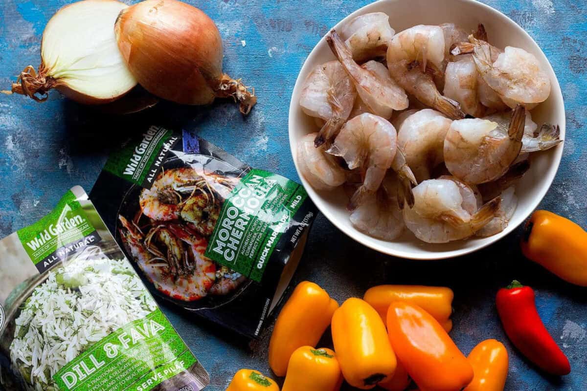 To make baked shrimp with chermoula sauce you need the following ingredients: Shrimp: It's best to use raw, deveined and peeled shrimp. You can leave the tail on or take it off as well. Onion: A bed of sliced onion is perfect for this dish. Peppers Chermoula sauce: this sauce gives so much flavor to the shrimps and onions. And since the sauce contains sunflower oil, there is no need for melted butter.
