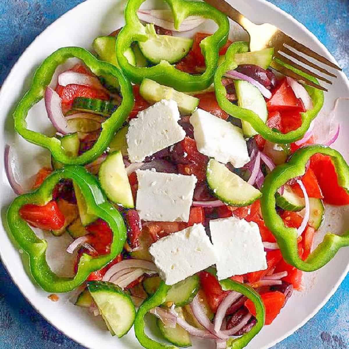 Here is a traditional Greek salad recipe, requiring just a few ingredients. It's the perfect starter or side dish for a Mediterranean meal.