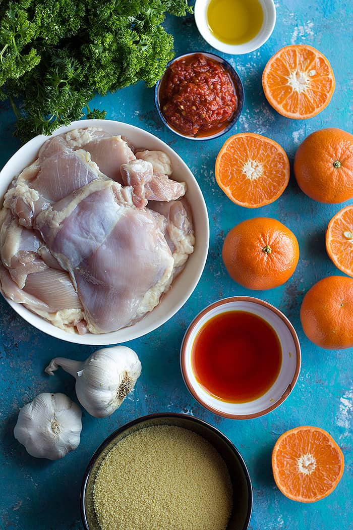 To make harissa chicken you need chicken thighs, harissa, olive oil, clementines, garlic and saffron