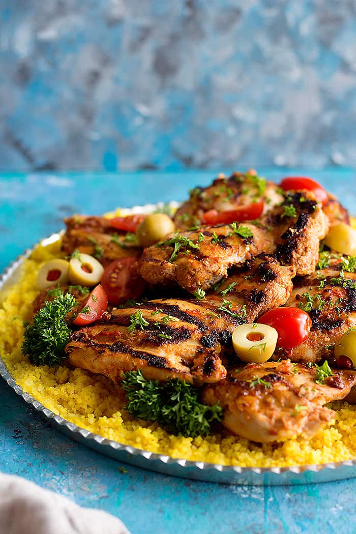 Grilled harissa chicken made with harissa paste and served with couscous