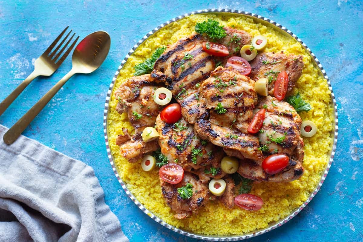 Grilled harissa chicken made with harissa paste and served with couscous