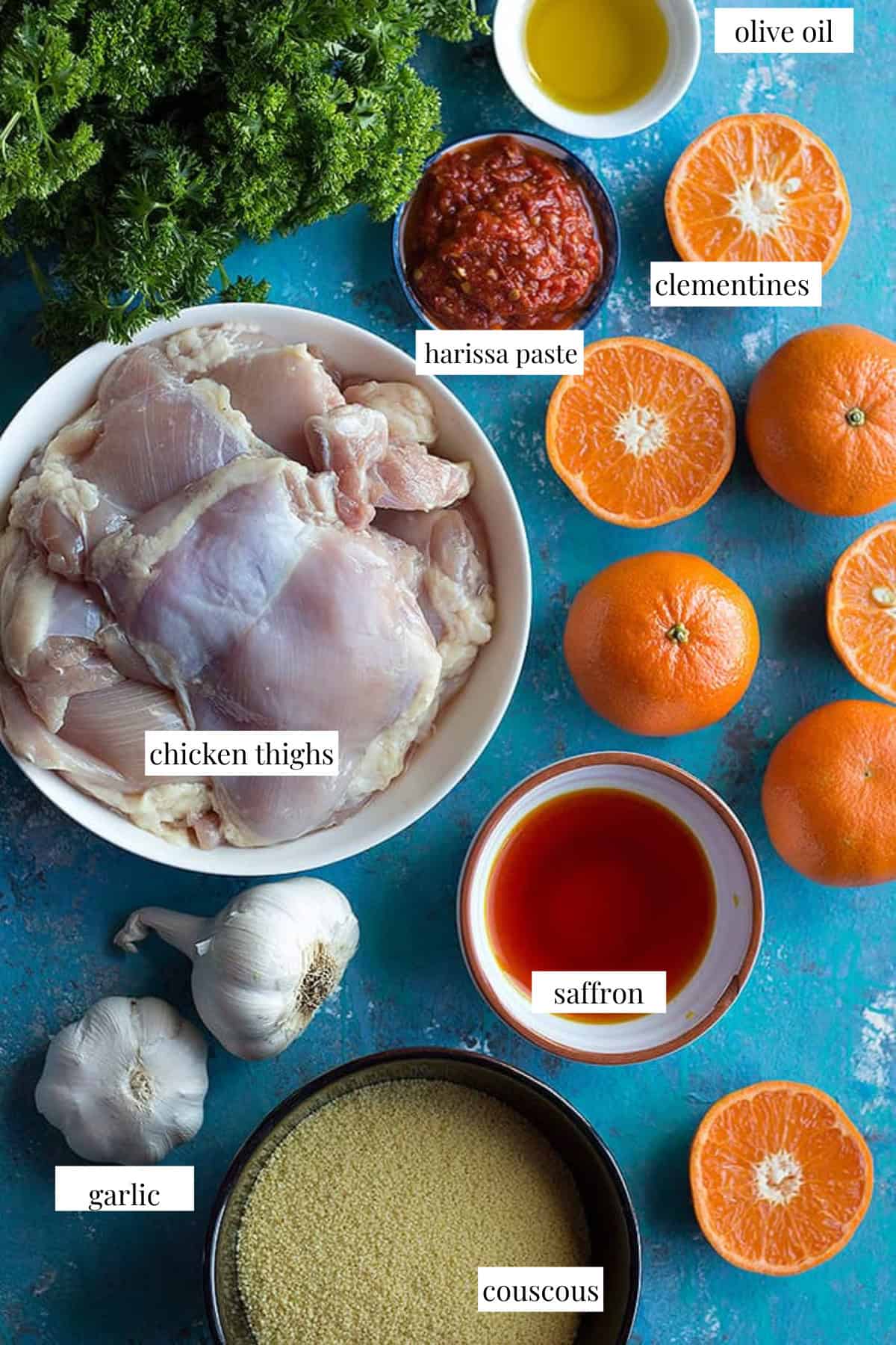 To make harissa chicken you need chicken thighs, harissa, olive oil, clementines, garlic and saffron