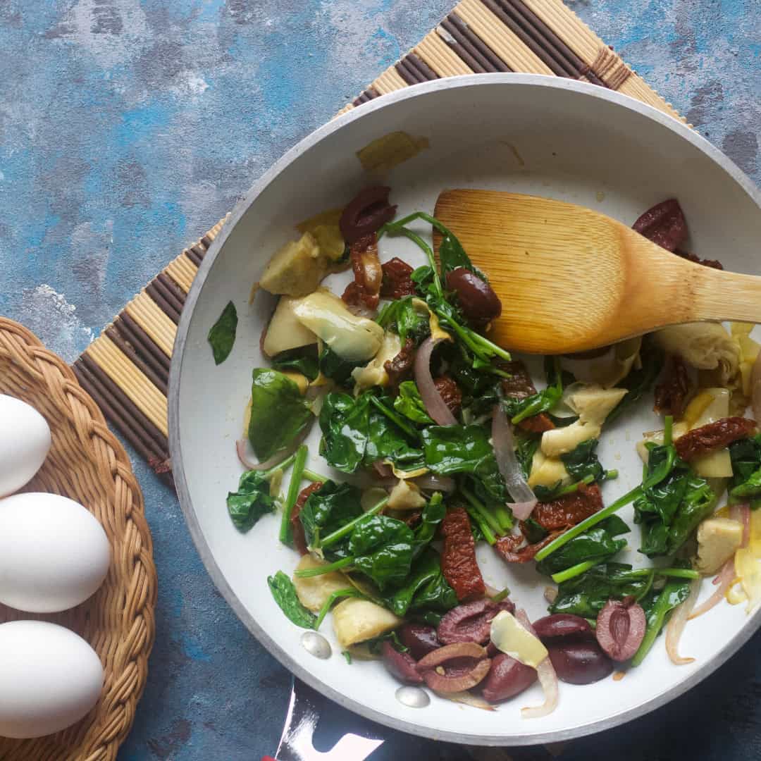 Add in the olives and sun dried tomatoes and give it a good stir.