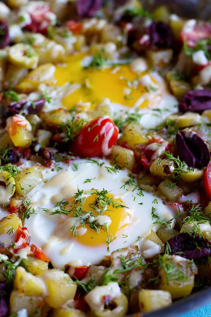 Mediterranean breakfast hash with eggs and tanini sauce. 
