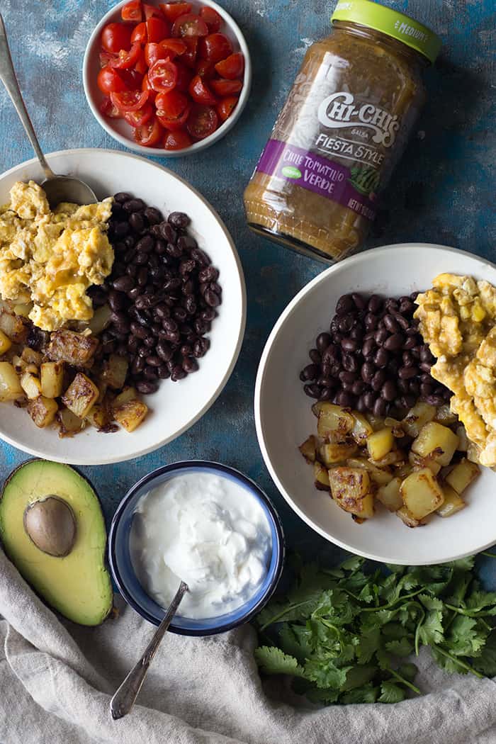 assemble Mexican Breakfast Bowl with with beans eggs and potatoes. 