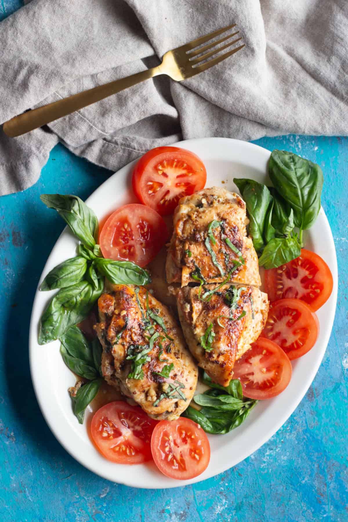 Caprese stuffed chicken breast is easy and packed with flavor. Juicy chicken breast stuffed with cheese, tomatoes and basil makes a delicious meal.&nbsp;