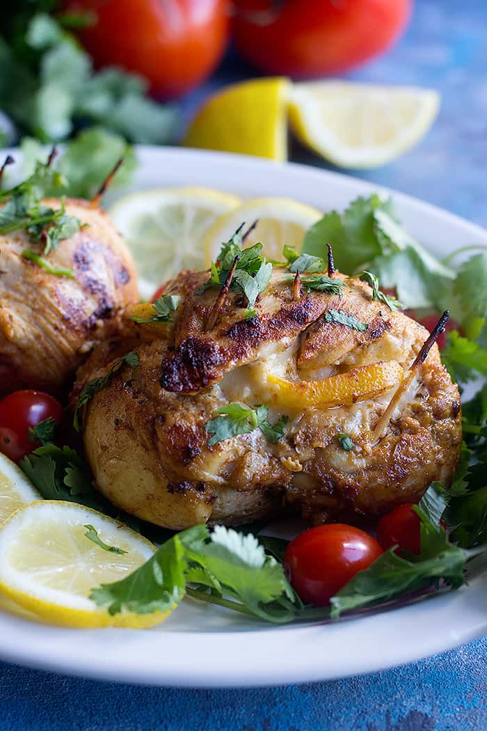 Cheese stuffed chicken breast makes a delicious dinner that's low carb and easy. Learn how to make these garlic lemon stuffed chicken breast at home with a few ingredients. 