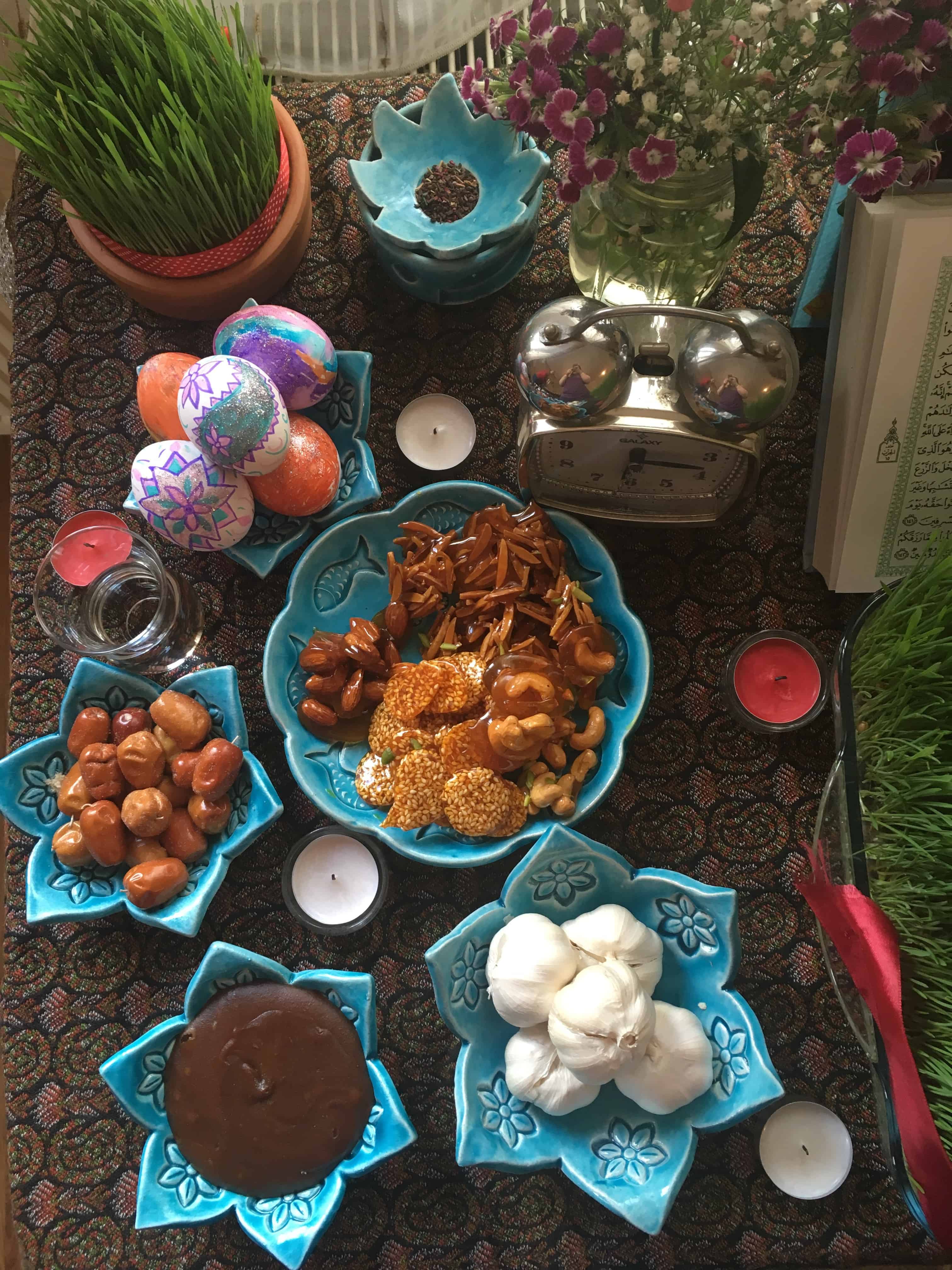 For Persian new year we set a table called haftseen. there are sweets, garlic and fruit on the table. 