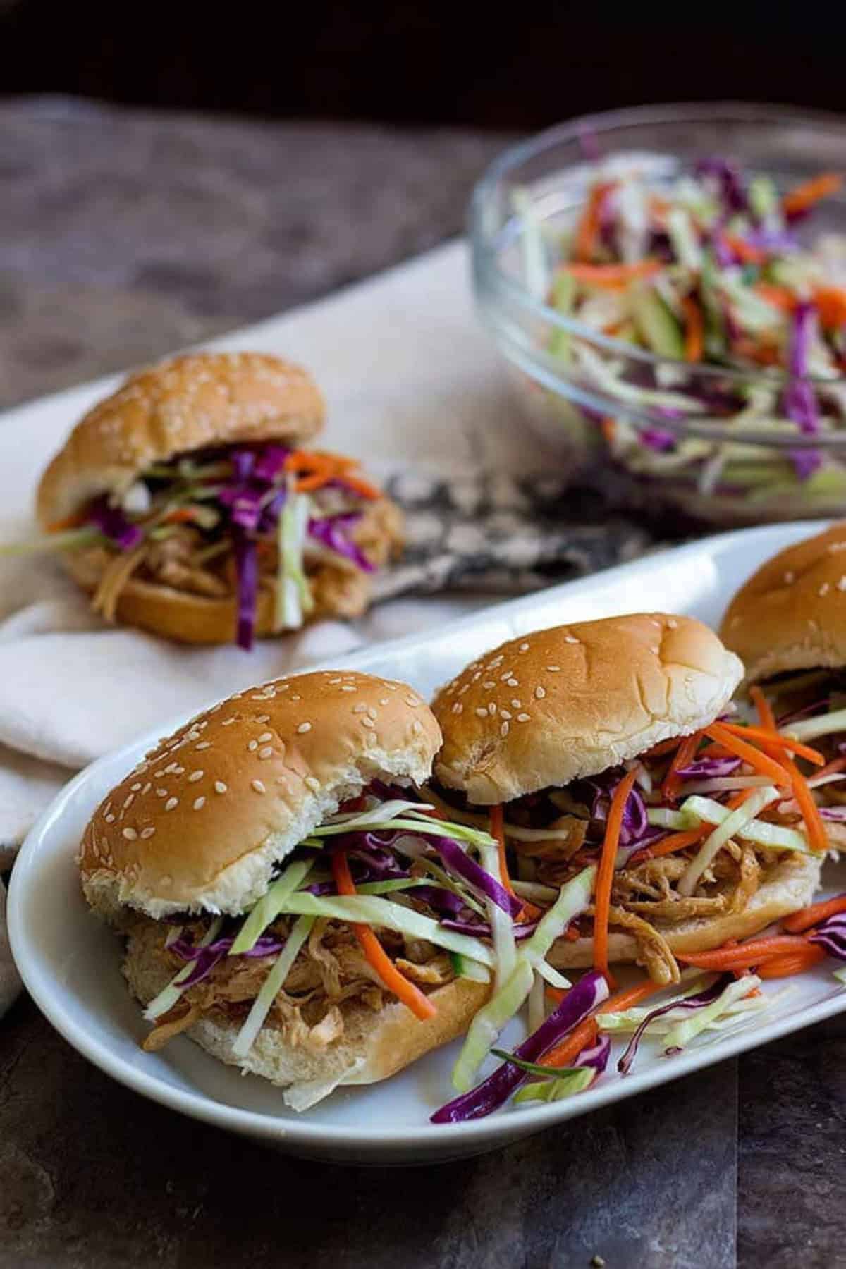 Asian Chicken Sliders with Slaw Asian Chicken Sliders - Put some shredded chicken and slaw on each slider and serve immediately.