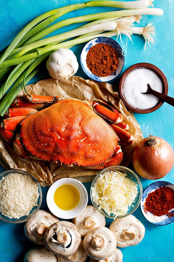 To make stuffed mushrooms with crab you need dungeness crab, onion, garlic,olive oil , mushrooms, spices and cheese.
