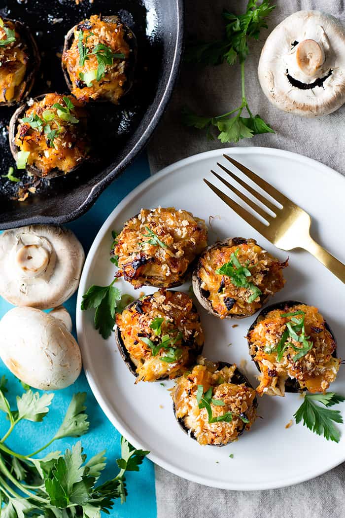 Spicy crab stuffed mushrooms are the perfect appetizer! Juicy mushrooms filled with a spicy crab filling are delicious and easy to make.