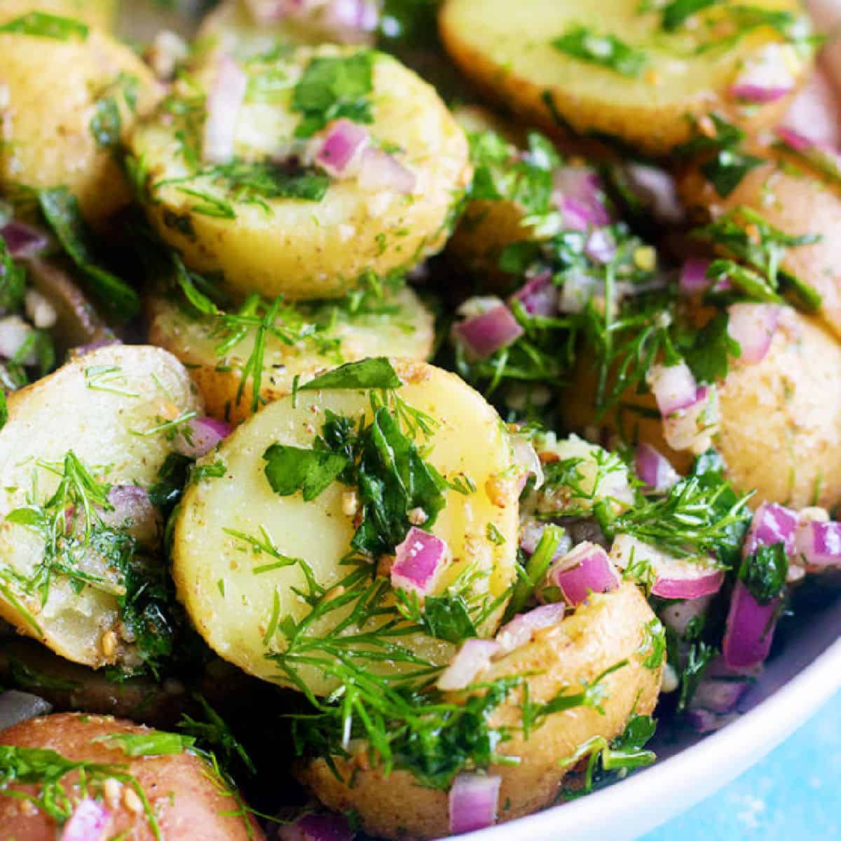 Mediterranean potato salad is so easy and simple. It's made with only a few ingredients and is packed with flavor thanks to a homemade zaatar dressing.