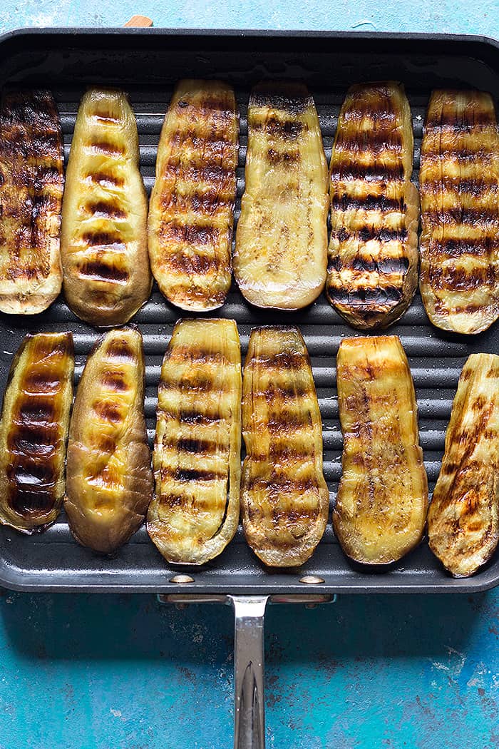 Grill eggplants on a grill pan on both sides. 