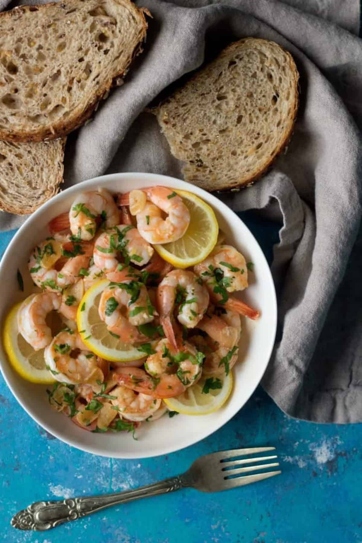 lemon prawns with bread pieces. 