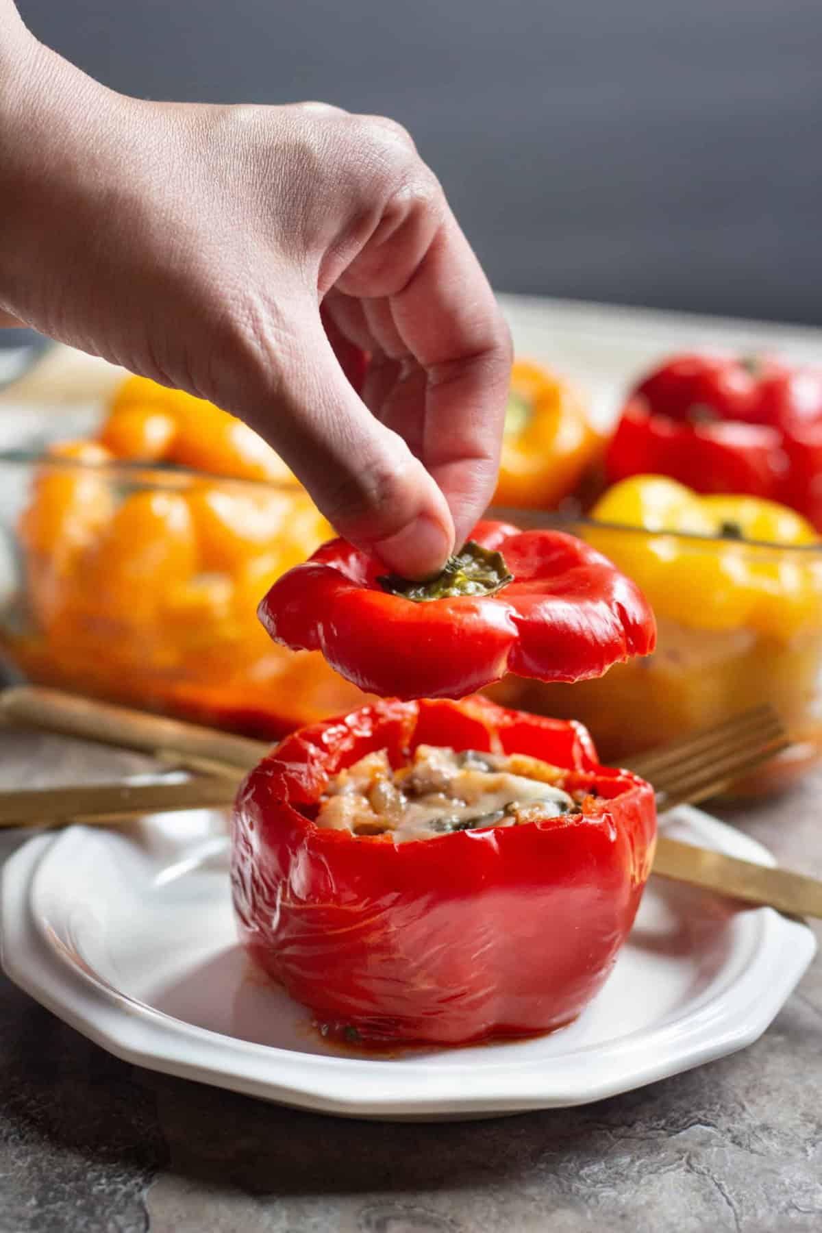 Italian Stuffed Peppers Italian stuffed pepper o a plate and sliced.