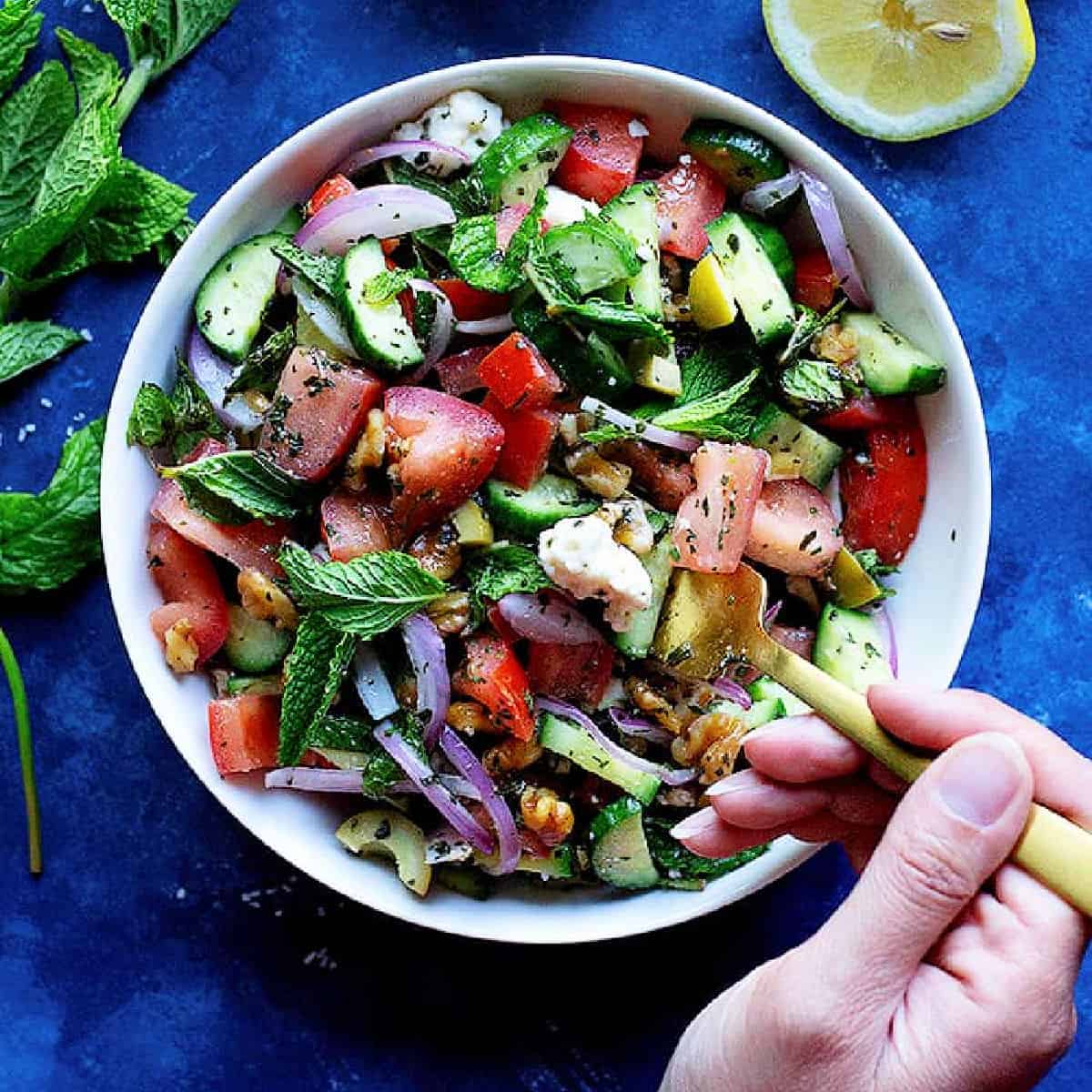 This cucumber tomato feta salad is easy, simple ready in 10 minutes! It's made with just a few ingredients and is perfect for any day!
