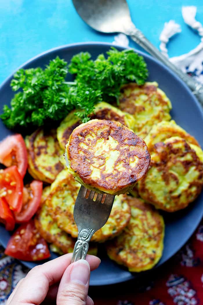 a piece of homemade potato pancake with vegetables. 