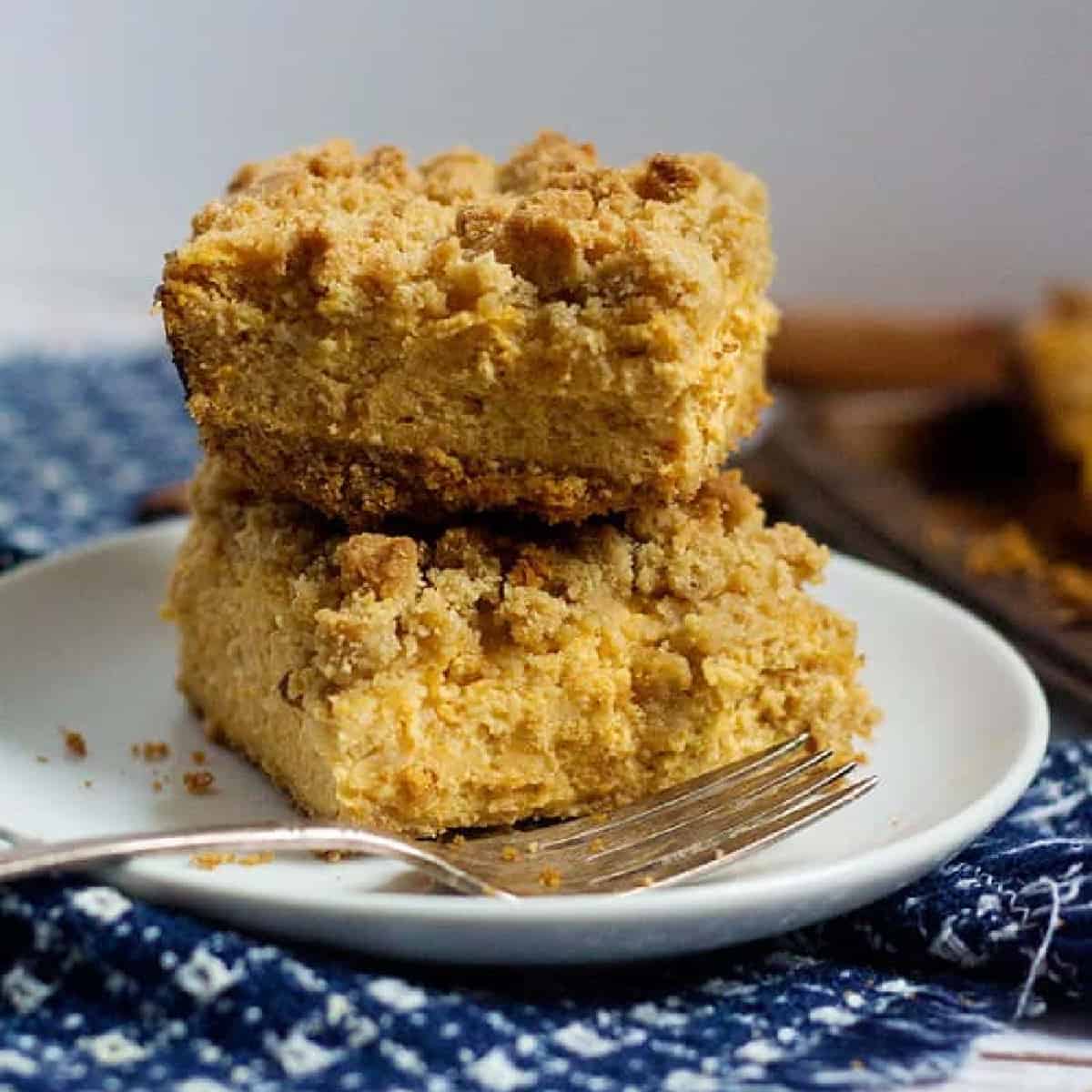 These pumpkin cheesecake bars are so simple and easy to make. Buttery graham crackers crust topped with luscious pumpkin cheesecake is perfect!
