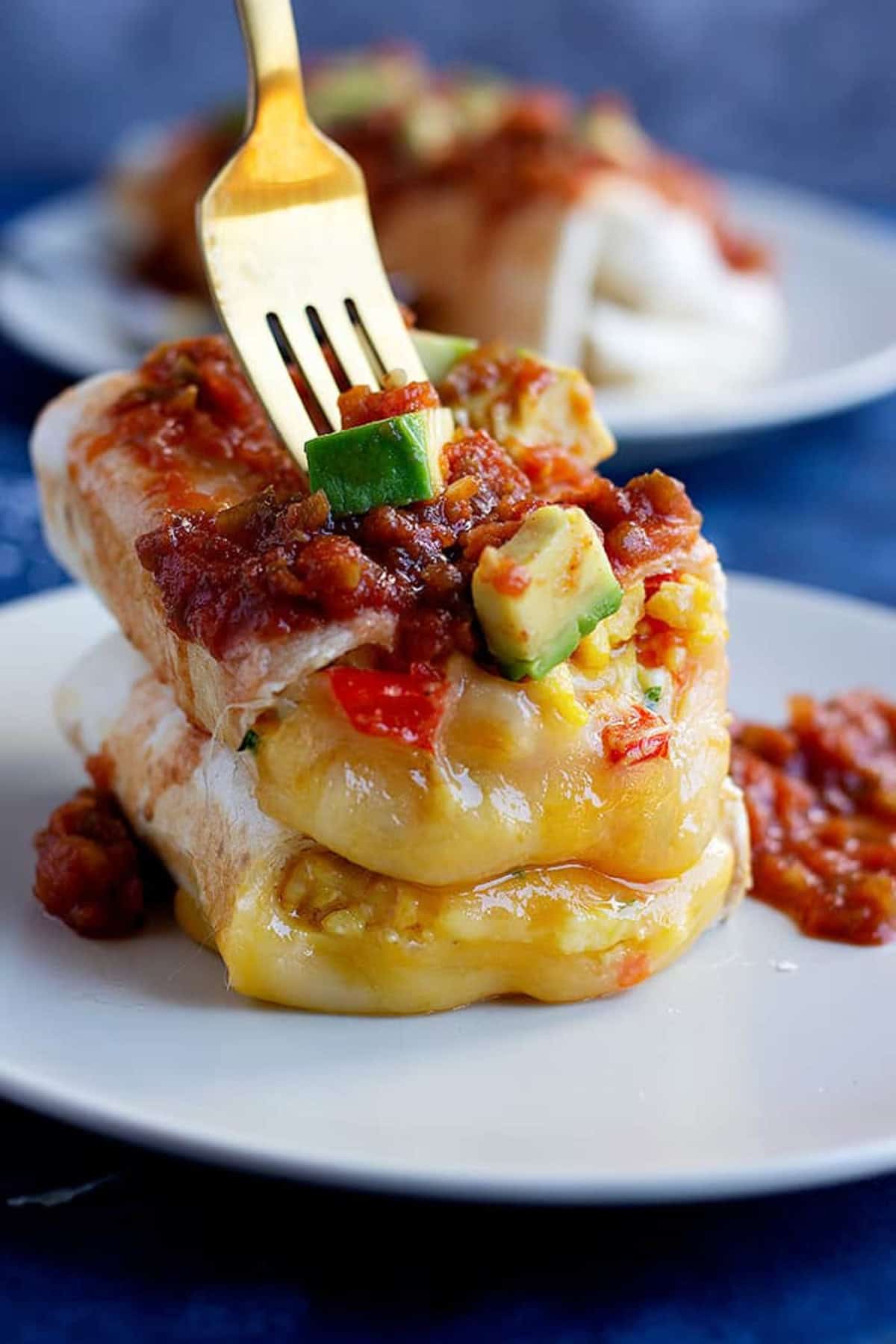 This is a delicious vegetarian breakfast burrito recipe that's freezer-friendly and easy to make. Breakfast burritos are great for meal prep and packed with veggies.