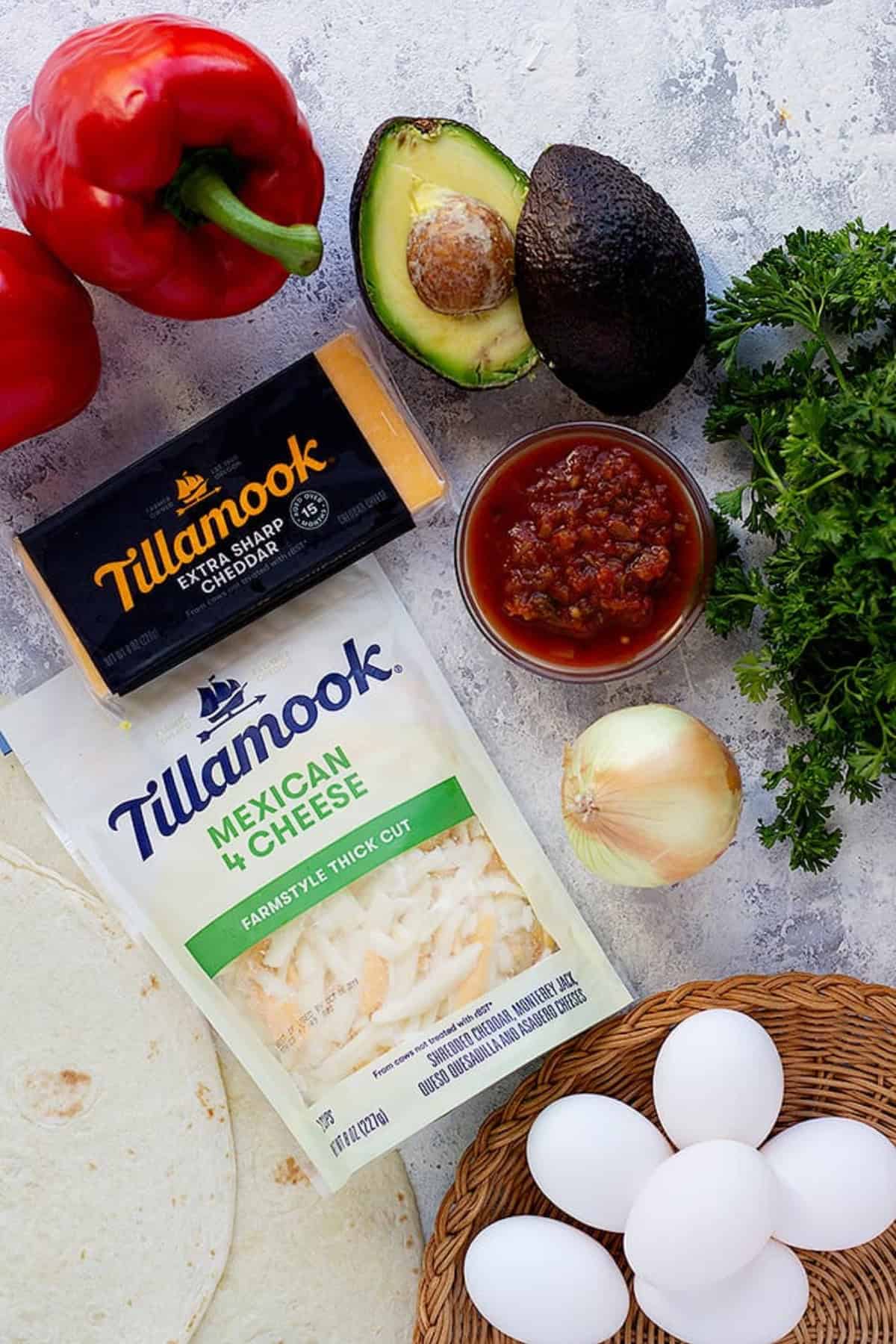 to make breakfast burritos you need eggs, avocados, onion, peppers, cheese and salsa.