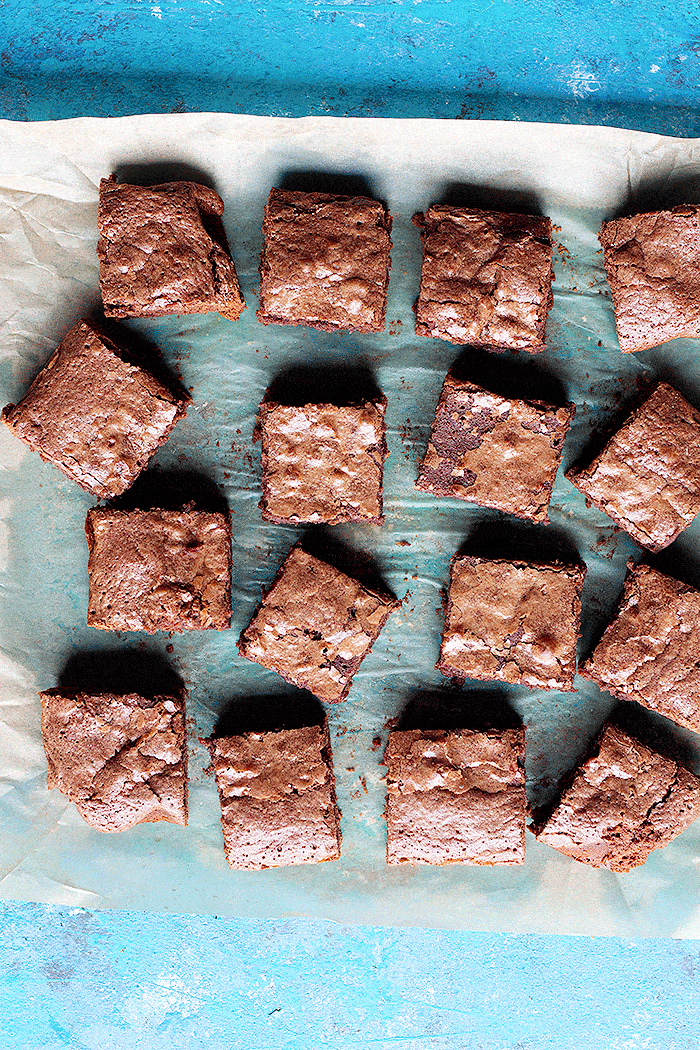 Slices of Nutella brownies on a parchment paper. 