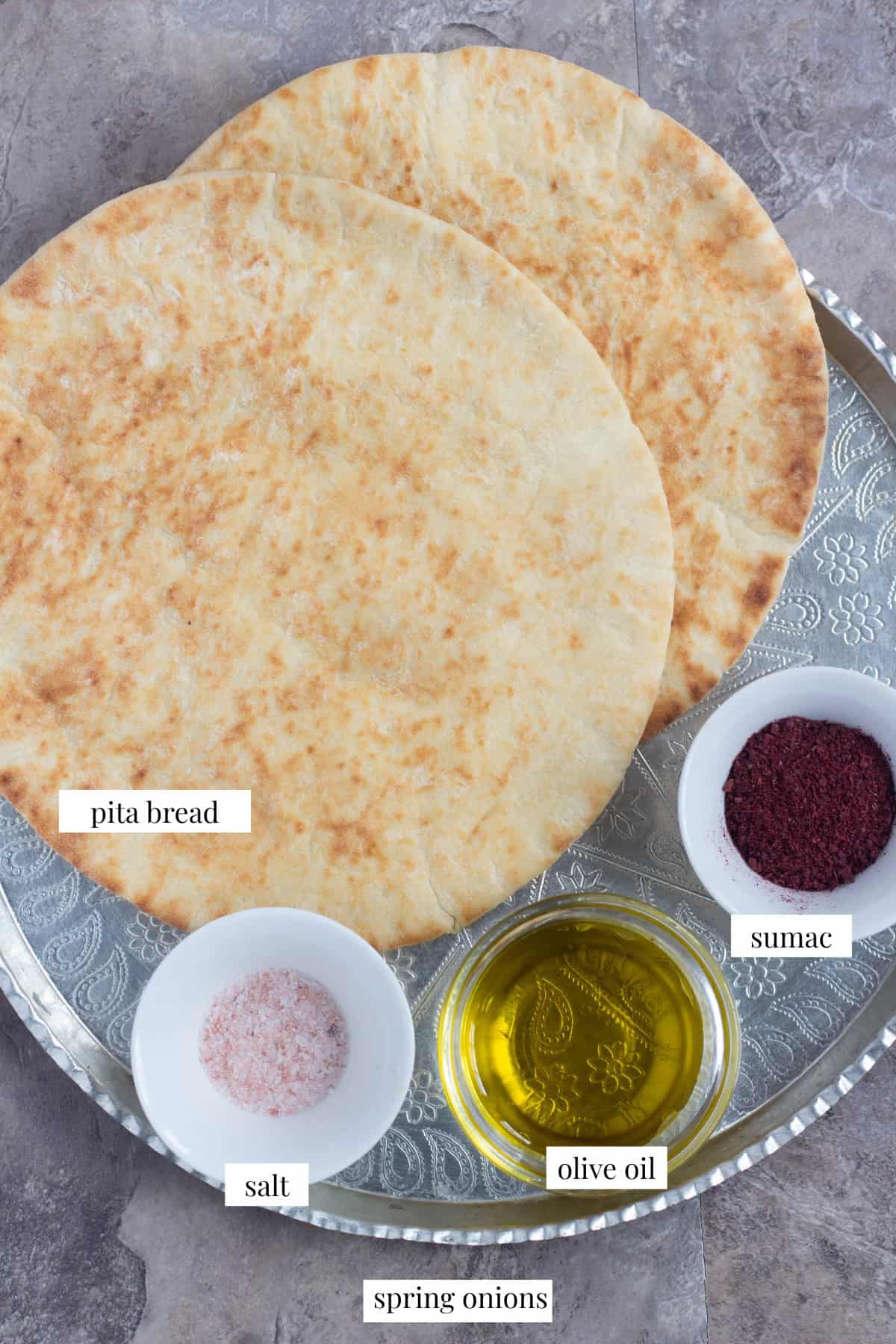 To make homemade pita chips you need pita bread, sumac, salt and olive oil.