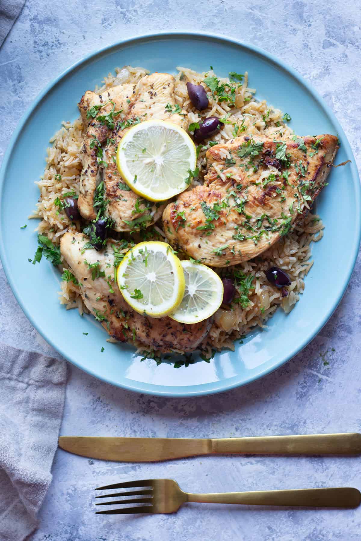 This one-pan chicken and rice is packed with delicious flavors. Read on and you'll see why this Greek chicken and rice recipe is perfect for a weeknight dinner.