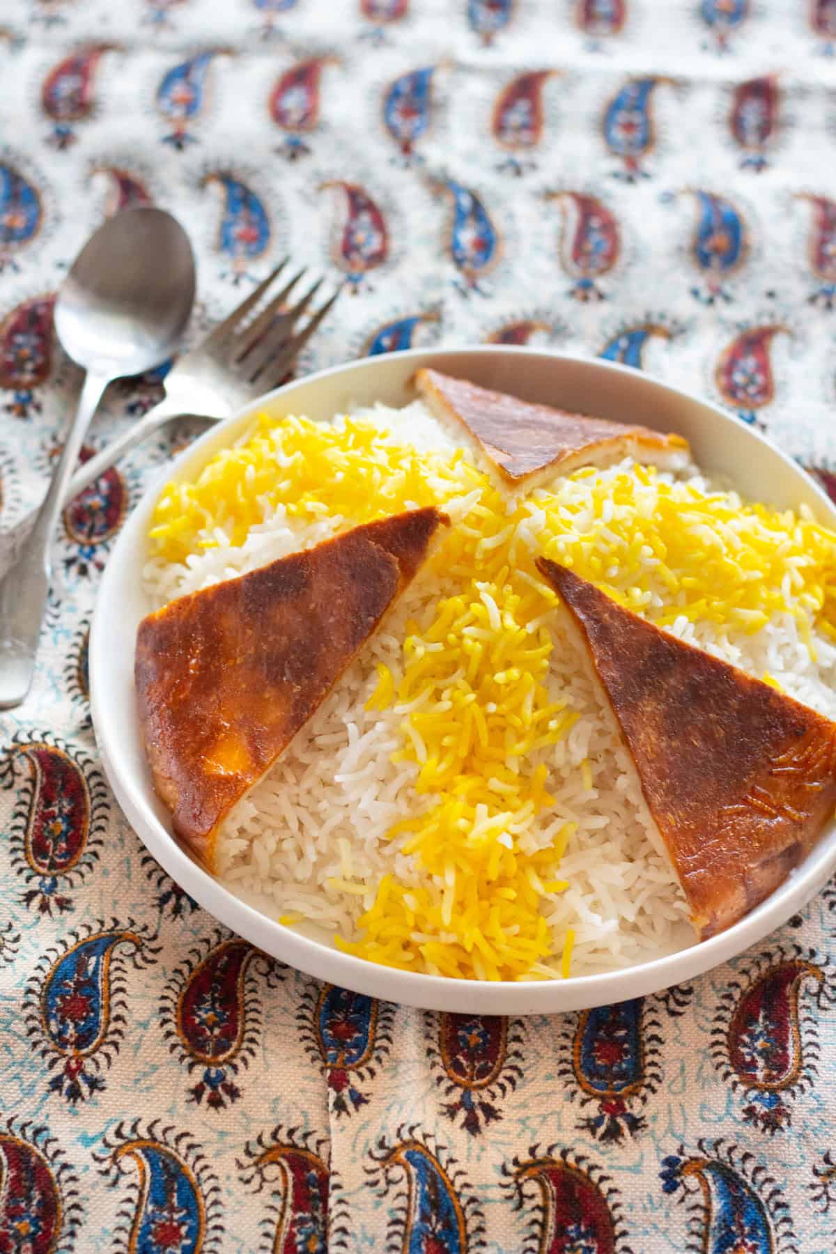 Persian Rice and Tahdig. Infuse some of the rice with brewed saffron and spread over the white Basmati Rice. 