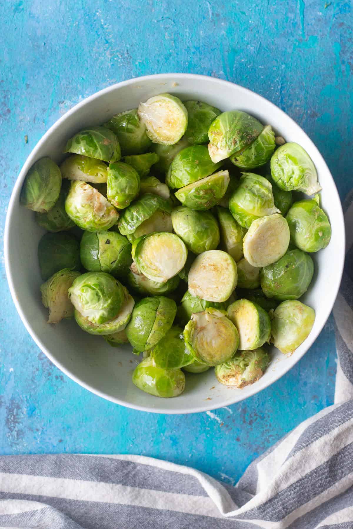 bowl of brussel sprouts cut in half and trimmed. 