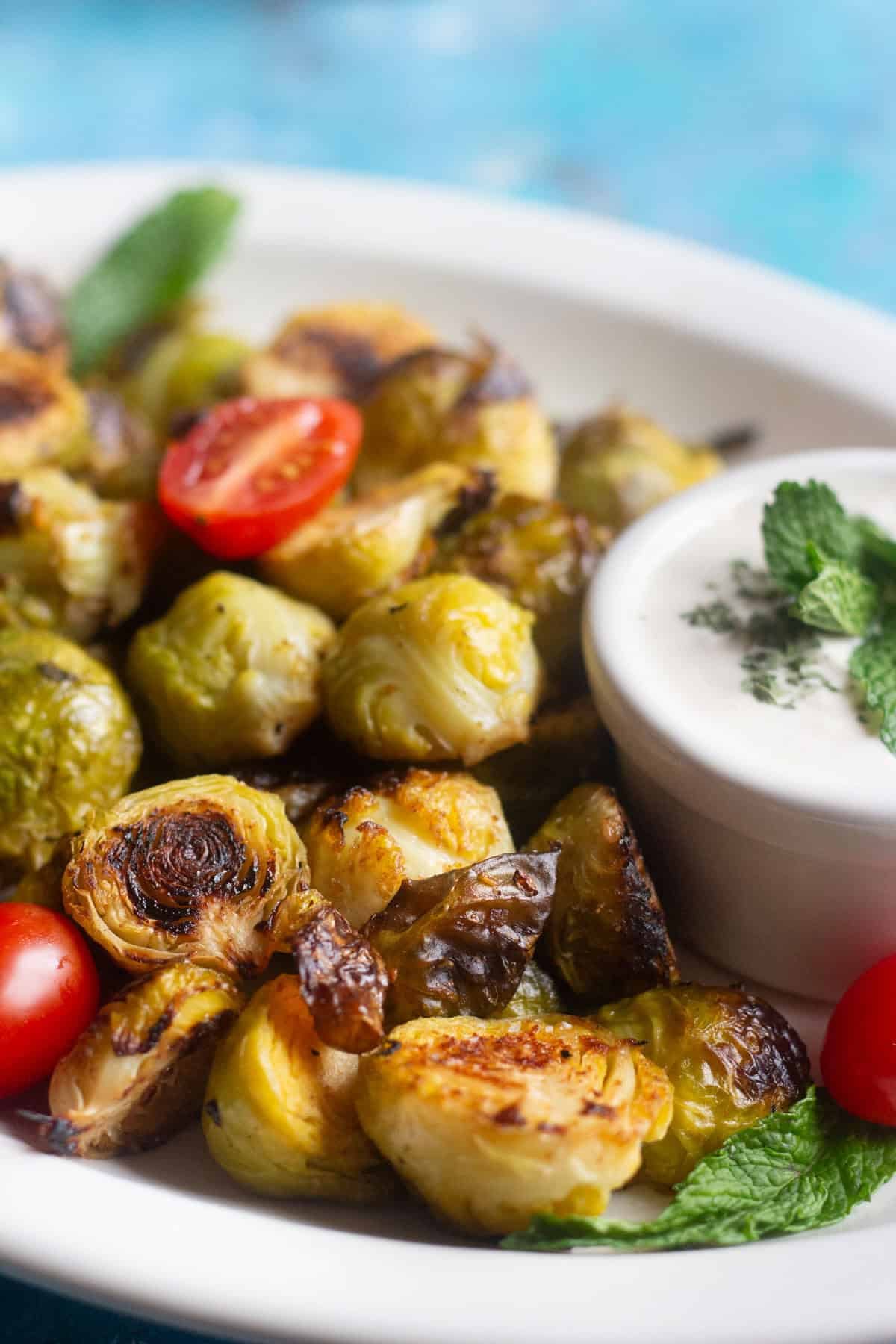 Oven roasted brussel sprouts are easy and ready in 20 minutes. Crispy brussel sprouts roasted in the oven with lemon and garlic make a great side dish.&nbsp;