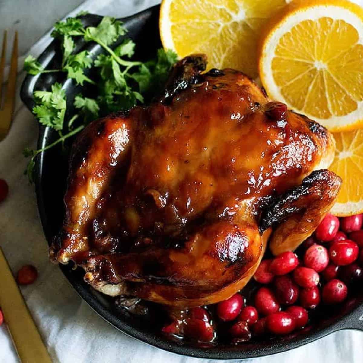 These Cranberry Orange Glazed Cornish Hens are perfect for holiday family dinners. The flavors of cranberries and oranges make this festive dinner a winner!