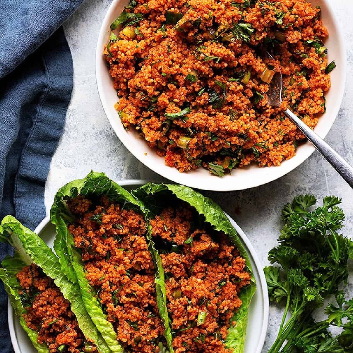 Turkish bulgur salad kisir in a bowl and served with lettuce.