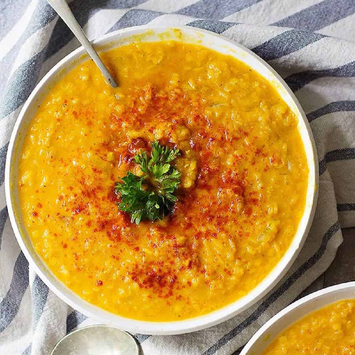 Ready in only 30 minutes, this turmeric ginger red lentil soup is everyone's favorite. This is a healthy and hearty soup recipe that's full of flavor!
