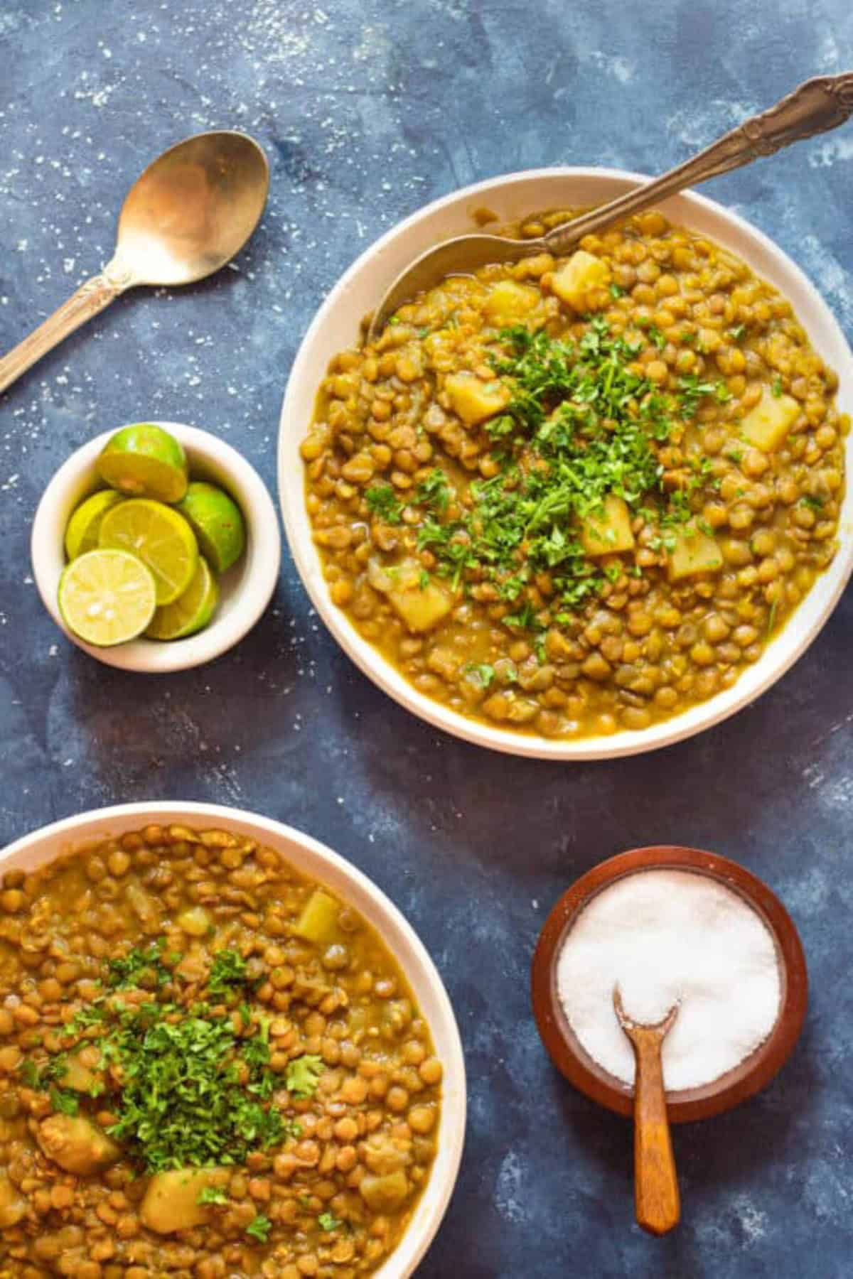 A bowl of lentil soup with lime juice. 