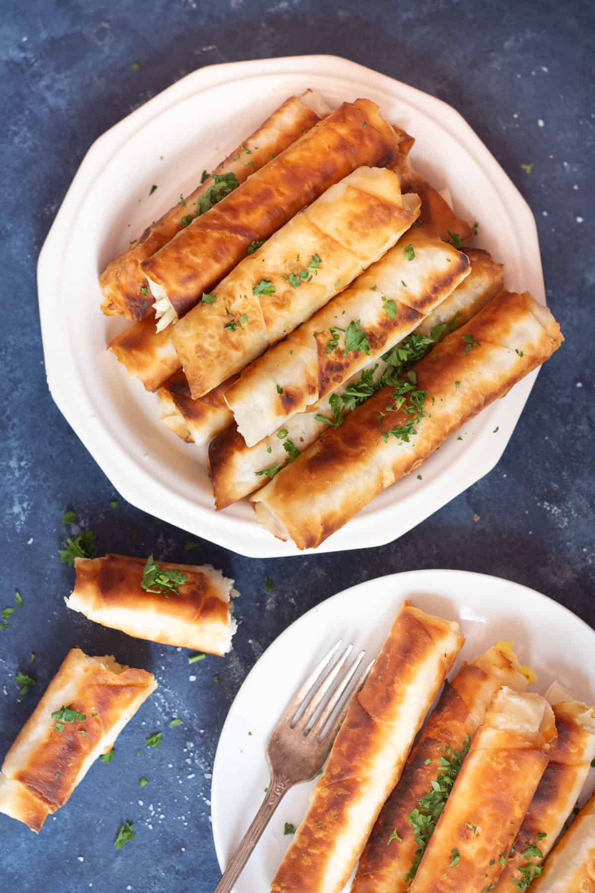 Borek is a Turkish savory crunchy pastry filled with different fillings such as cheese or potatoes. Learn how to make Turkish borek recipe by watching our step-by-step video and tutorial. They are perfect as a midday snack or for breakfast and you can make them in advance and freeze them for later.