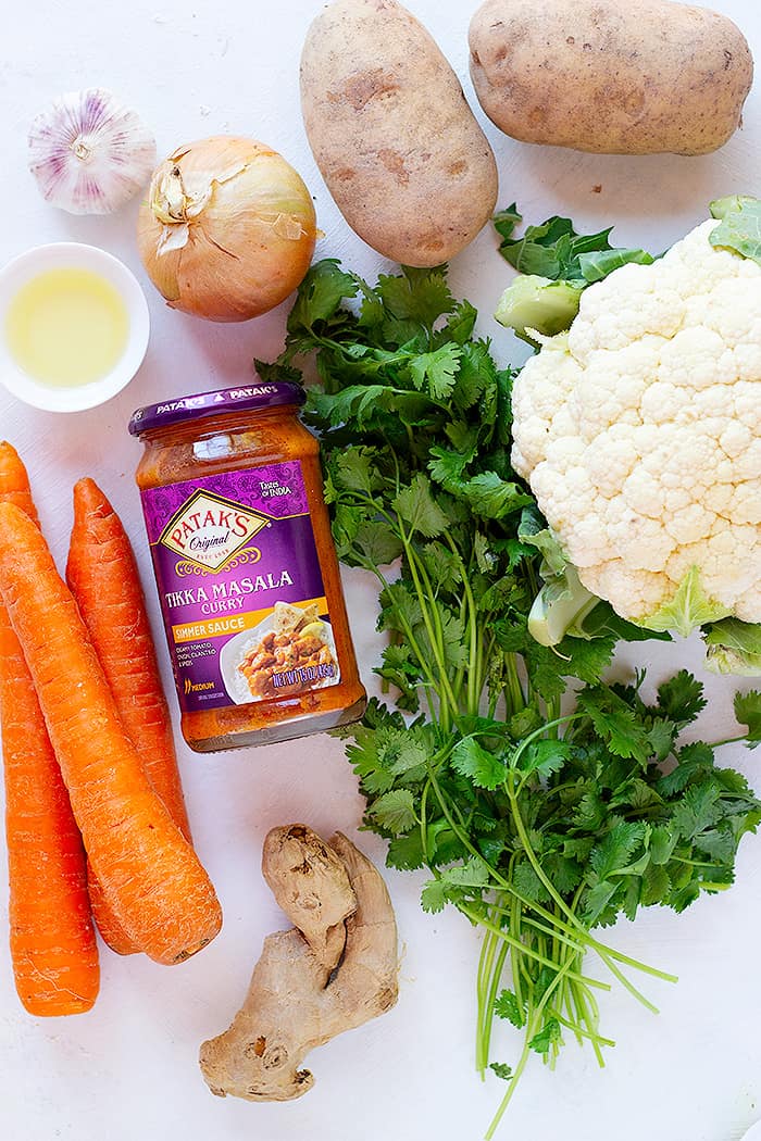 To make veggie tikka masala you need carrots, onion, garlic, ginger, potatoes, oil and patak's curry sauce. 