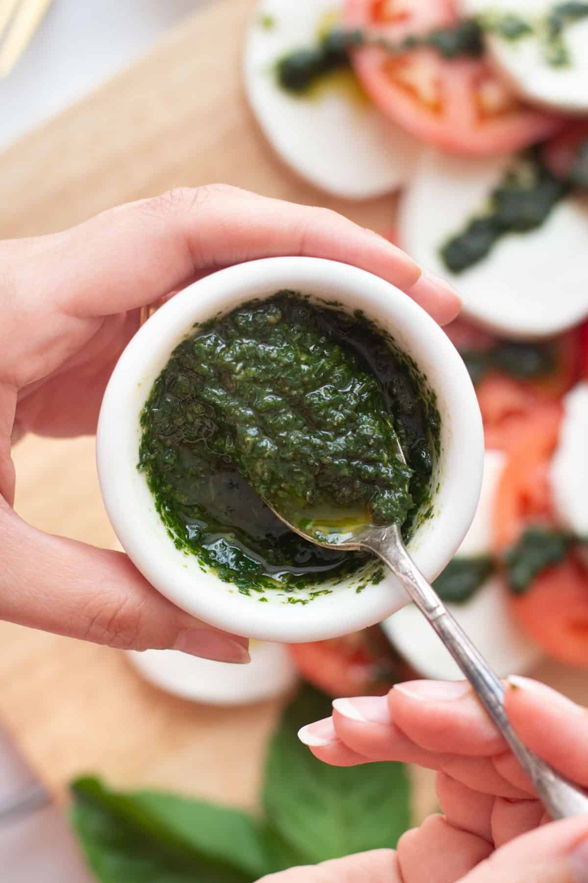 Basil oil is a delicious condiment that you can use on salads, chicken, fish or sandwiches. It's vegan, gluten free, dairy free and Whole30 approved.&nbsp;