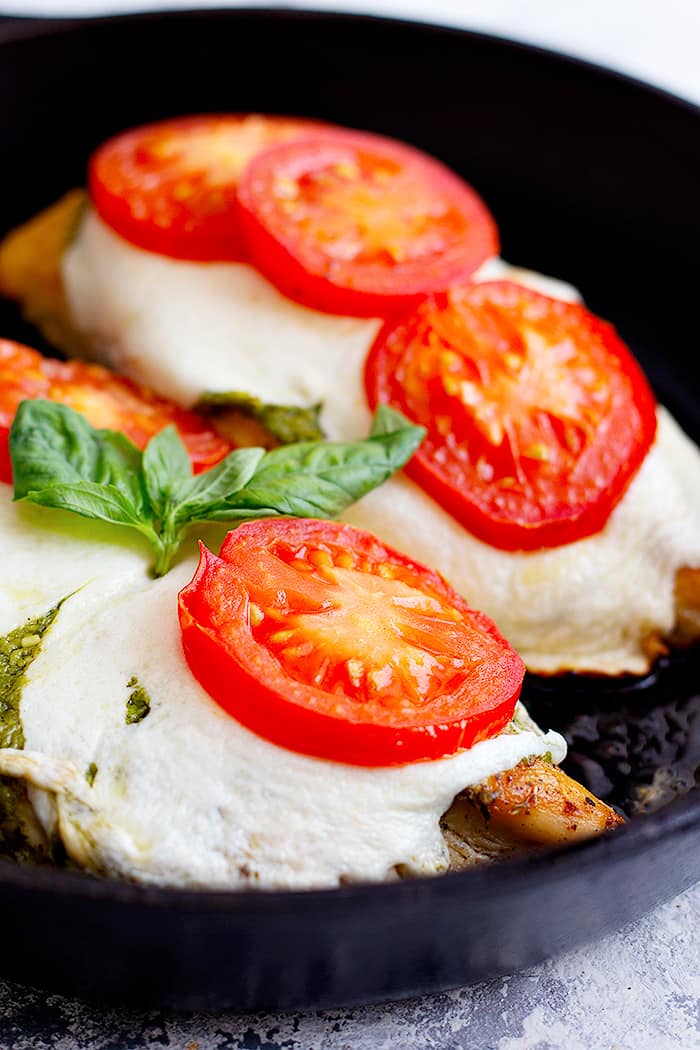 Here’s an easy caprese chicken recipe that’s ready in only 30 minutes. Made with fresh tomatoes, mozzarella and pesto, this is a delicious easy weeknight dinner. Learn how to make this easy chicken recipe at home with our video and step-by-step tutorial. 