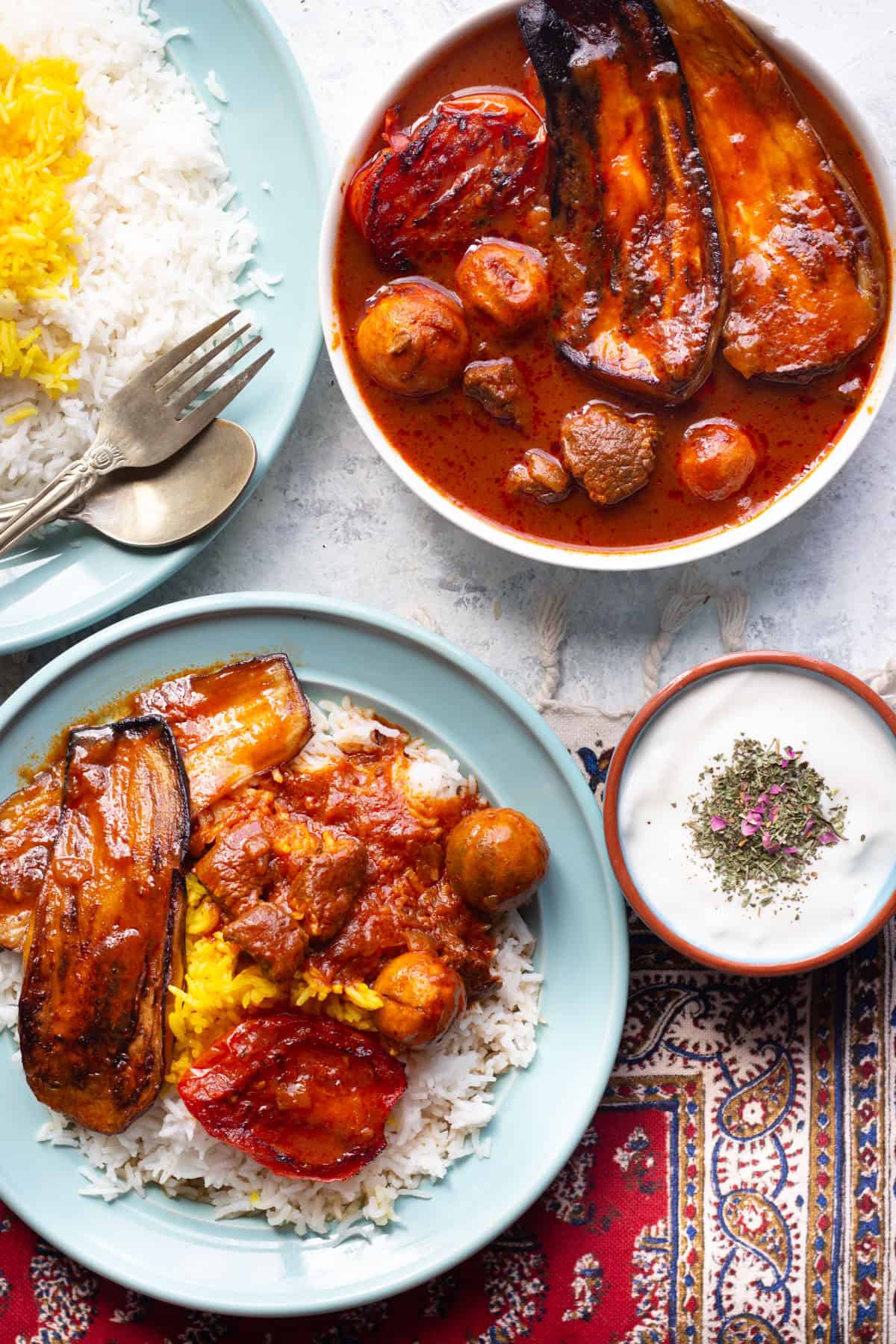 Khoresh bademjan is a delicious Persian eggplant stew that's served with rice. This Persian stew is usually served with rice and tahdig.