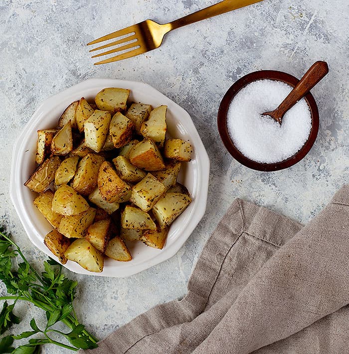 Potatoes are flavored with salt, pepper, oregano and garlic. Then roasted to perfection. 